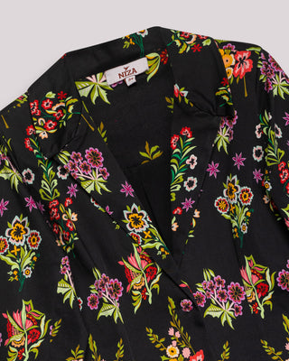 Representación visual de blazer con estampado floral y bordado penélope